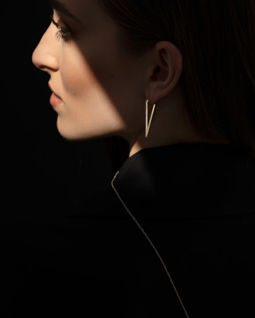 Minimalist contemporary large triangle earrings.