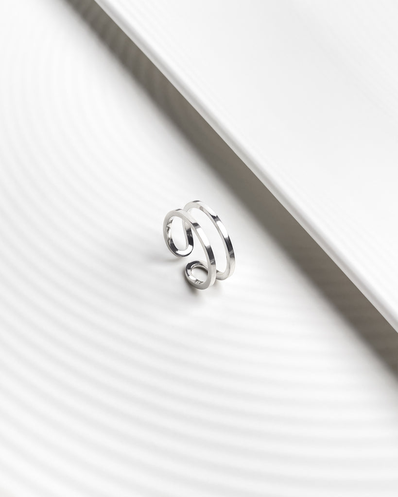 Minimalist open ring designed to create the illusion of stacking rings.Minimalist open ring designed to create the illusion of stacking rings.