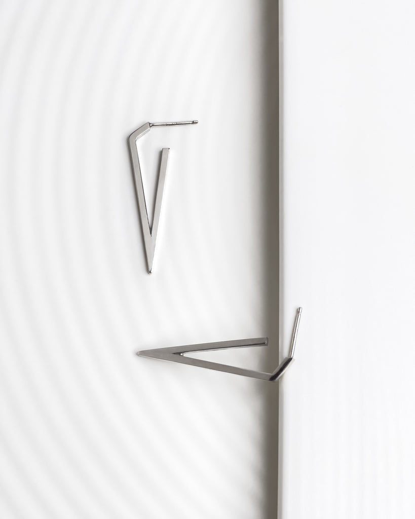 Minimalist contemporary large triangle earrings.