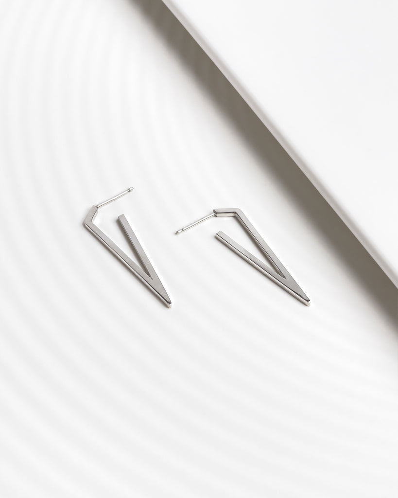 Minimalist contemporary large triangle earrings.