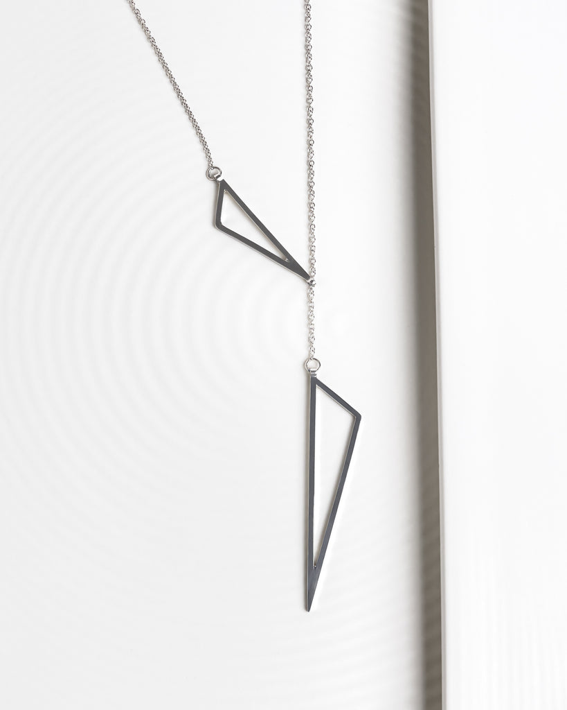 Statement adjustable necklace with two triangle pendants.